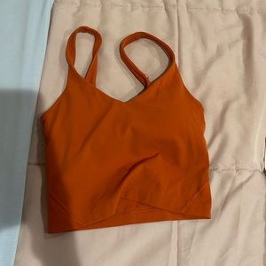 Orange align tank from Lululemon, goes for 68 now